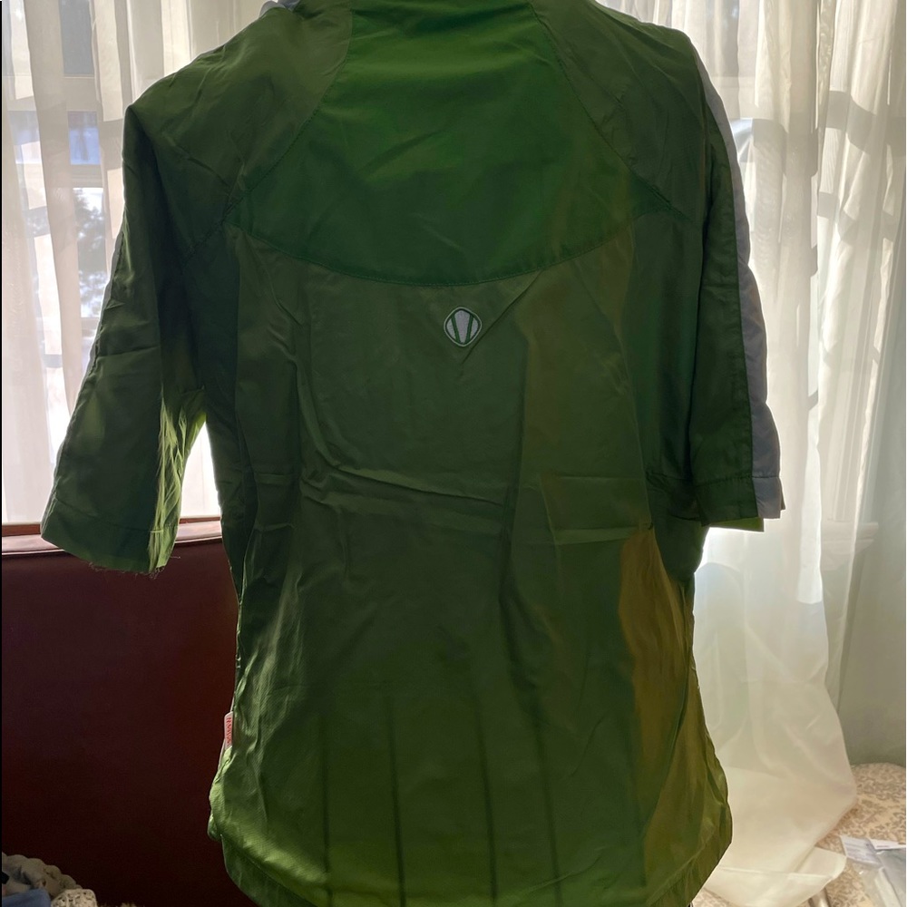 Shirt sleeved green golf rain jacket